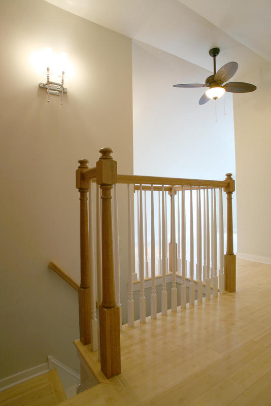 Custom built railings and posts. View looking into bedroom
